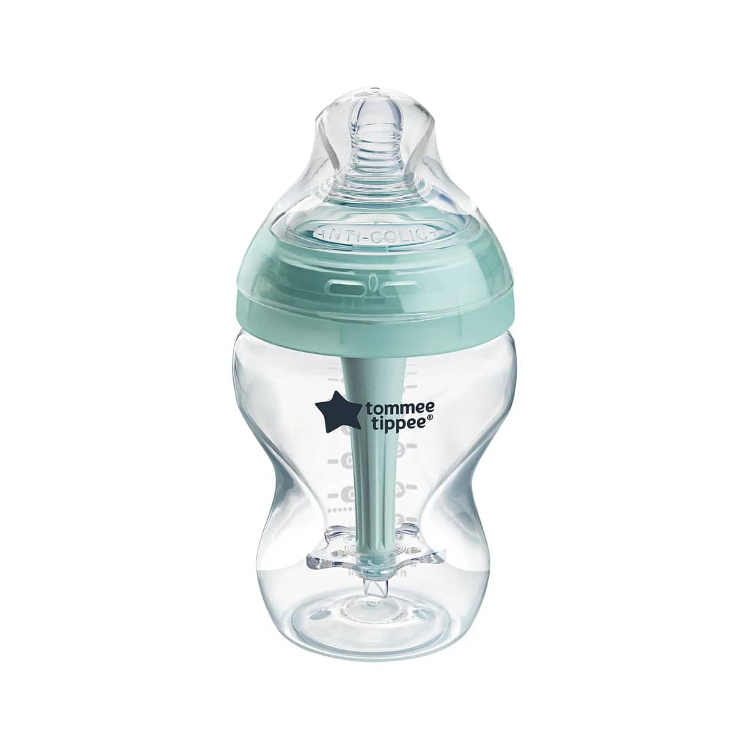 A clear baby bottle with a light blue anti-colic nipple and base, featuring measurement markings on the side and the logo of the brand 'tommee tippee' visible.